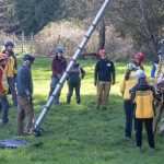 Trainees gather at the tripod during Sprint 2026 IFO training.