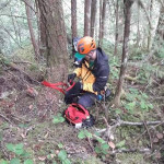 Responder Michael begins rigging the rope system by starting with an anchor.
