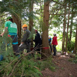 The haul team pull on the rope to raise the attendants back up the cliff.