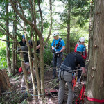 The two rescuers prepare to descend the cliff.