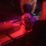 Bella is in the litter and about to be strapped in for transport to the road. Night time photo of dog in a litter.