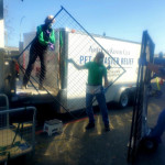 Two volunteers unload the AKC Reunite trailer at the shelter in Pierce County, WA. Two volunteers unload the AKC Reunite trailer at the shelter in Pierce County, WA.
