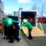 Two volunteers unload the AKC Reunite trailer at the shelter in Pierce County, WA. Two volunteers unload the AKC Reunite trailer at the shelter in Pierce County, WA.