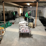 A volunteer wheels supplies into place at an undisclosed facility in Pierce County. A volunteer moves bags of supplies on a cart into a vacant building being converted into a temporary animal shelter.